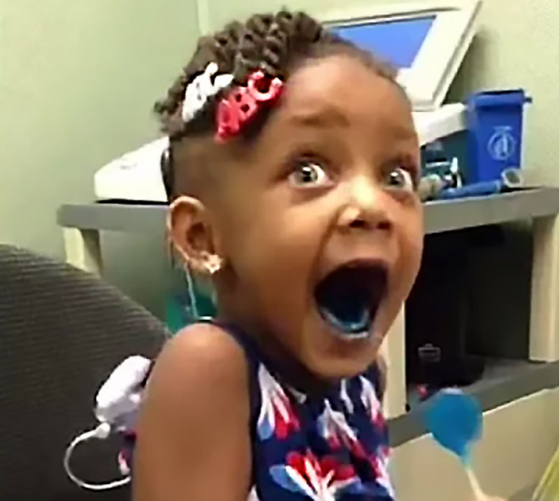 child hears for first time with cochlear implant